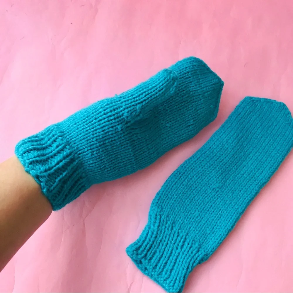 New turquoise hand knitted wool mittens